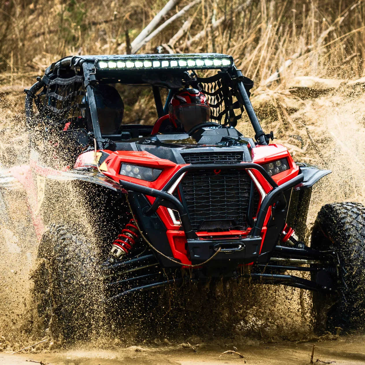 UTV driving through mud